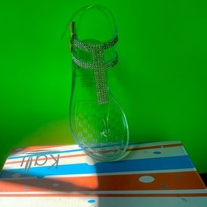 Strappy slip on thong sandals comes in multiple colors and rhinestone design.